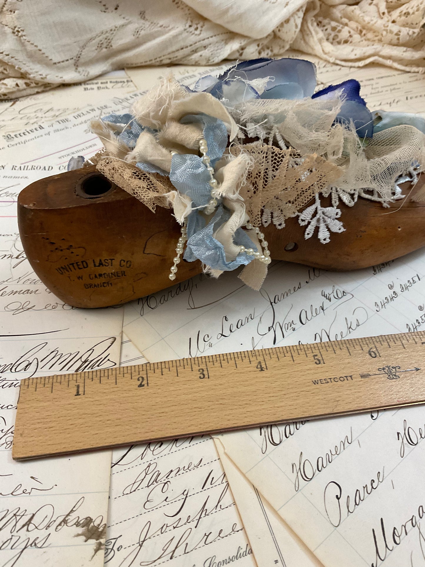 Vintage shoe form with blue flowers