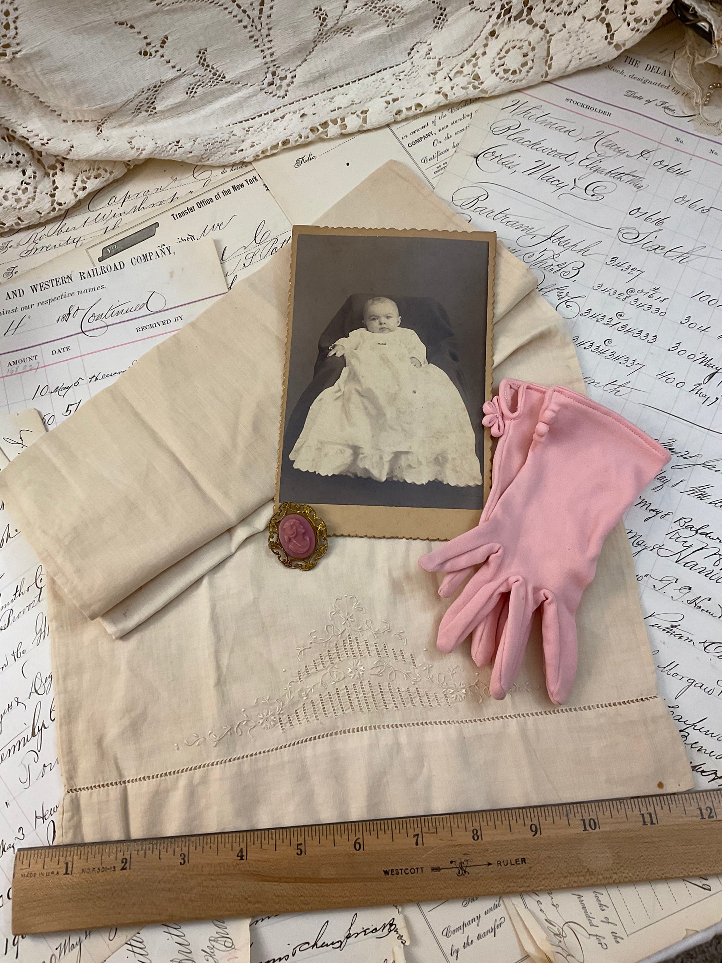 Cameo, photo, child’s gloves, and child size pillowcase