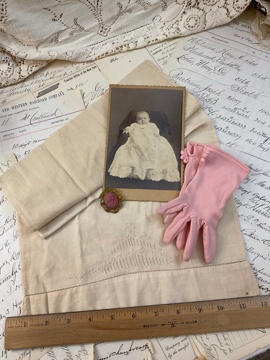 Cameo, photo, child’s gloves, and child size pillowcase