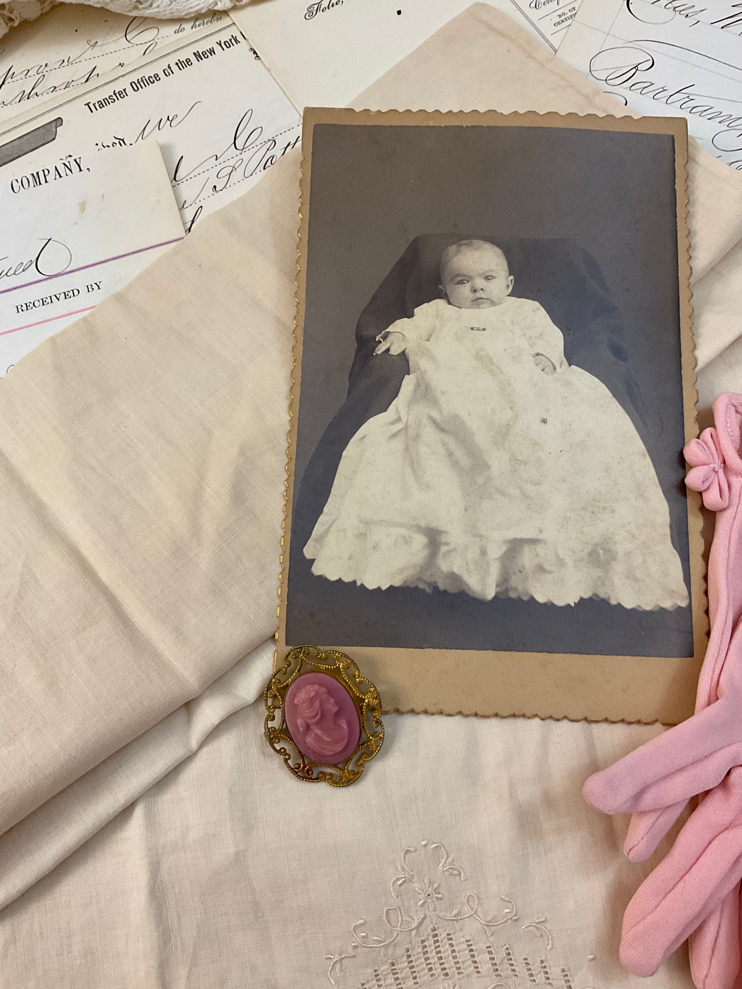 Cameo, photo, child’s gloves, and child size pillowcase