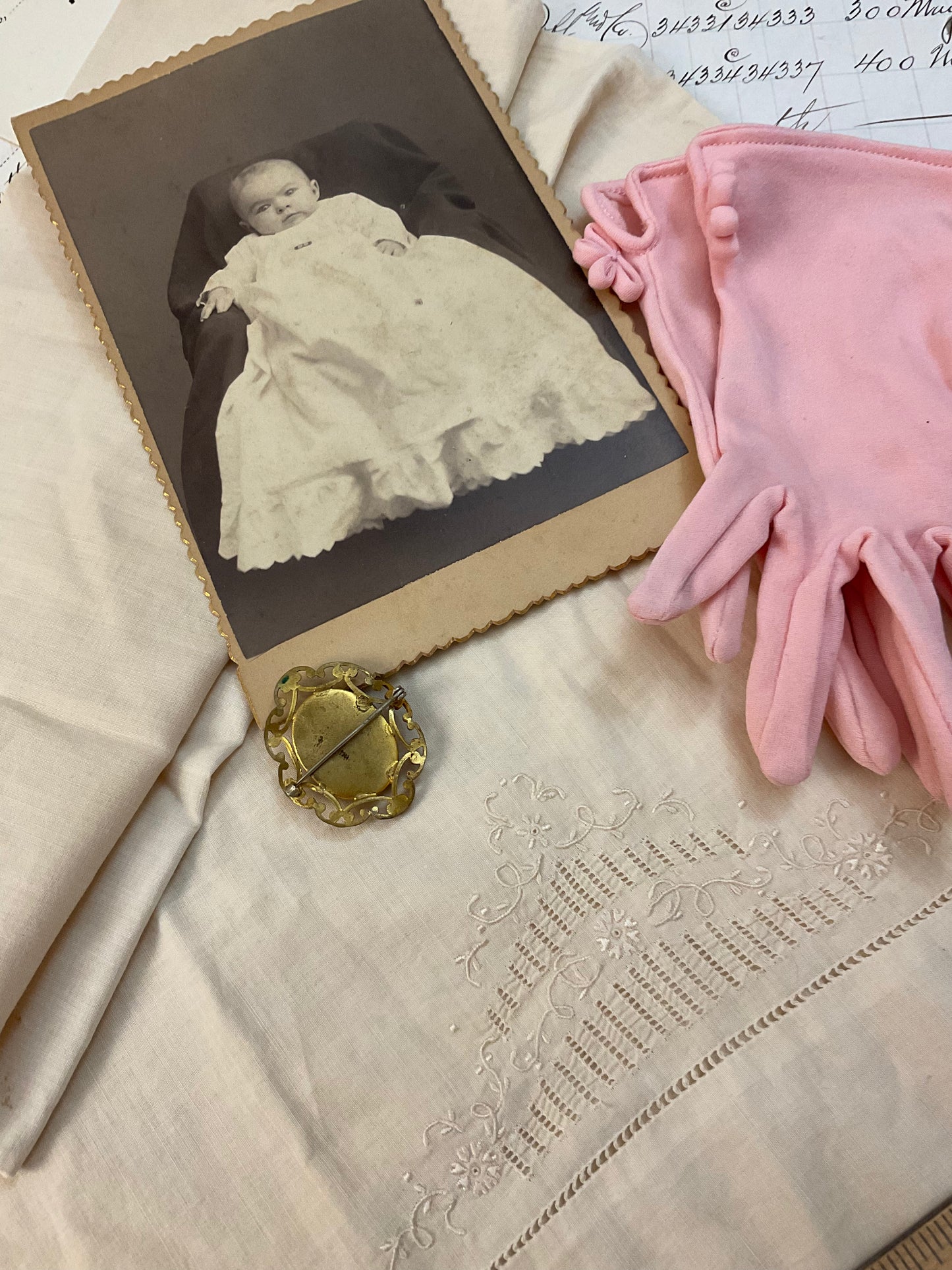 Cameo, photo, child’s gloves, and child size pillowcase